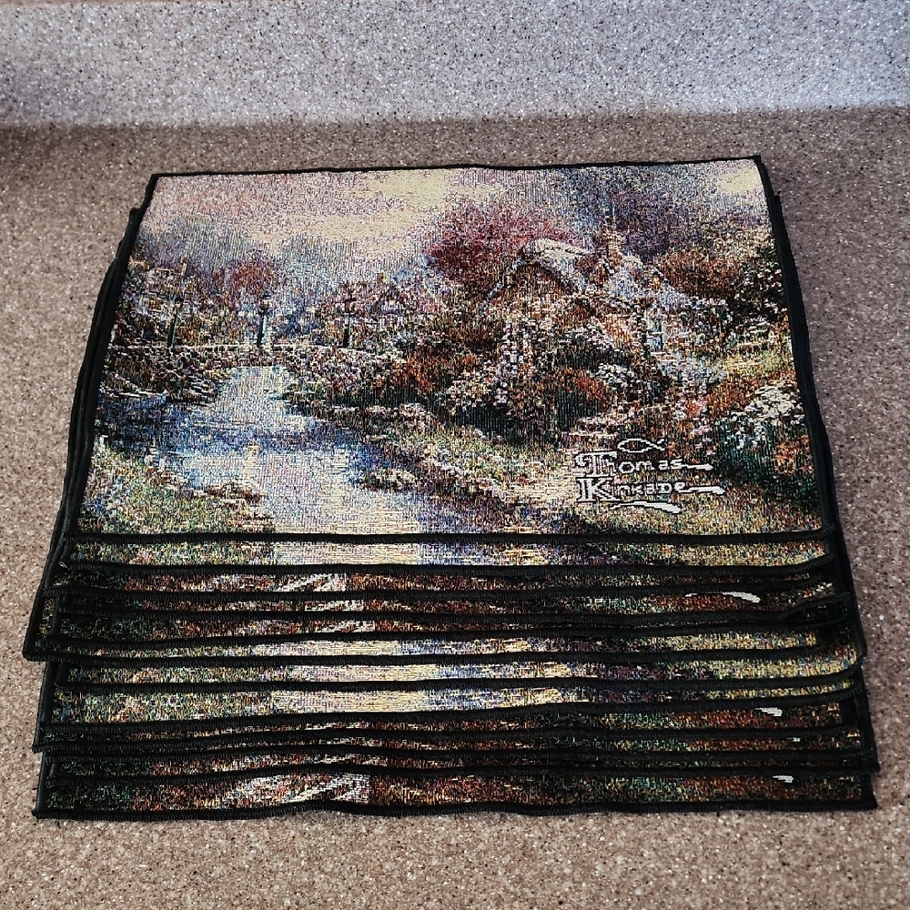 12 pieces of Thomas Kinkade Winter Scene Placemats Set with Blue and Green Hues.